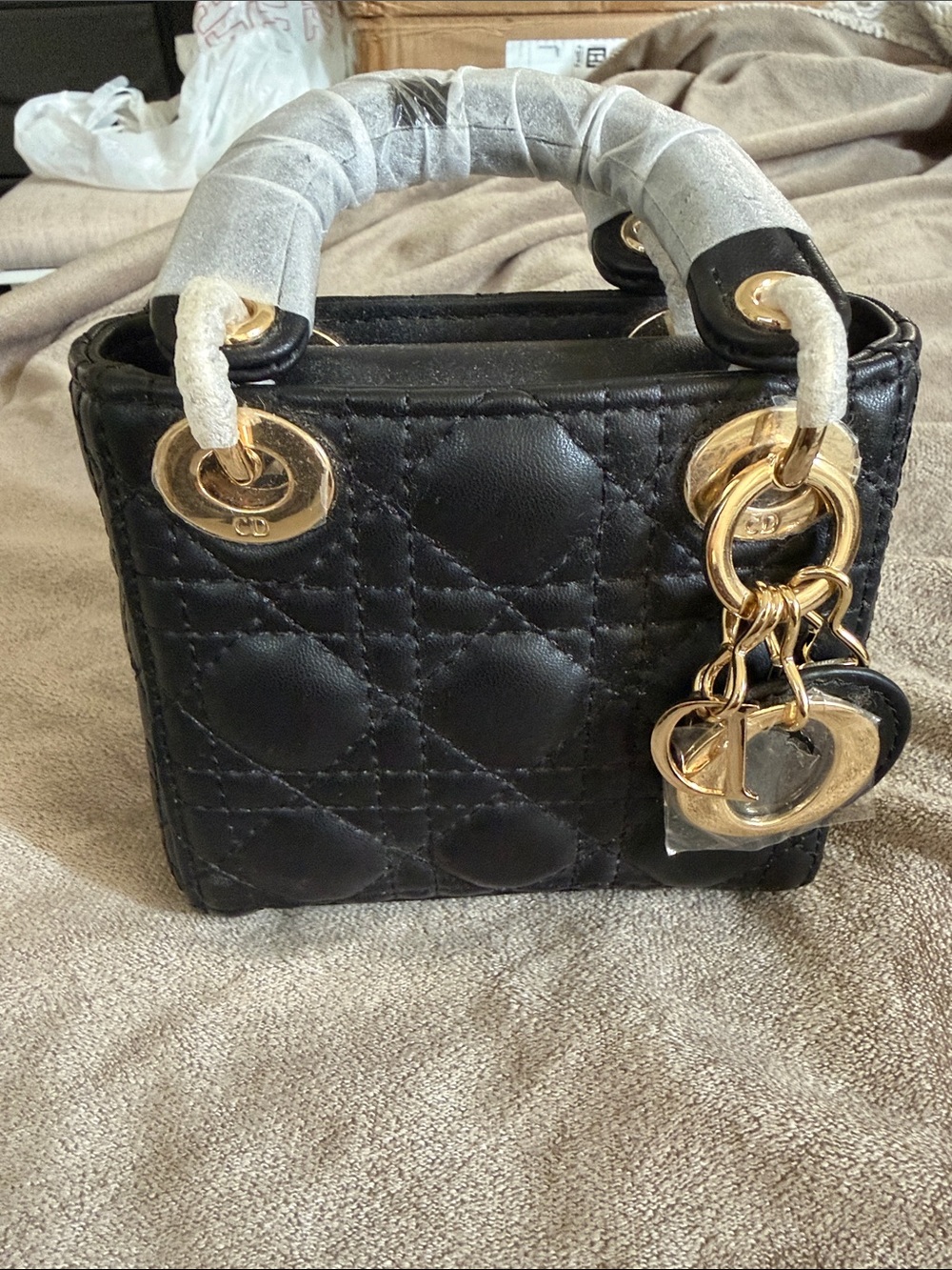 Black Quilted Leather Top-Handle Bag with Gold Hardware